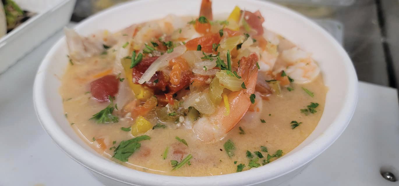 A&H’s Caribbean seafood stew is chock-full of prawns, scallops, cod, and shrimp in a tomato, lime, and coconut broth.